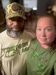 A man and woman standing next to each other.